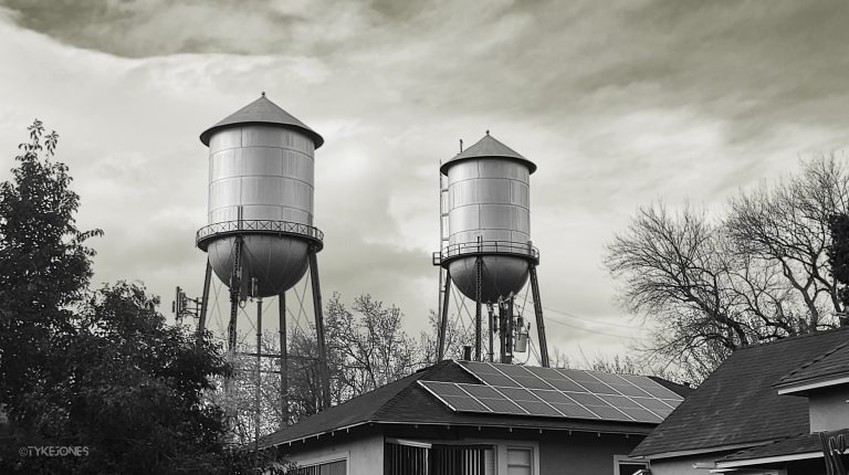 Black and white photo of two water towers