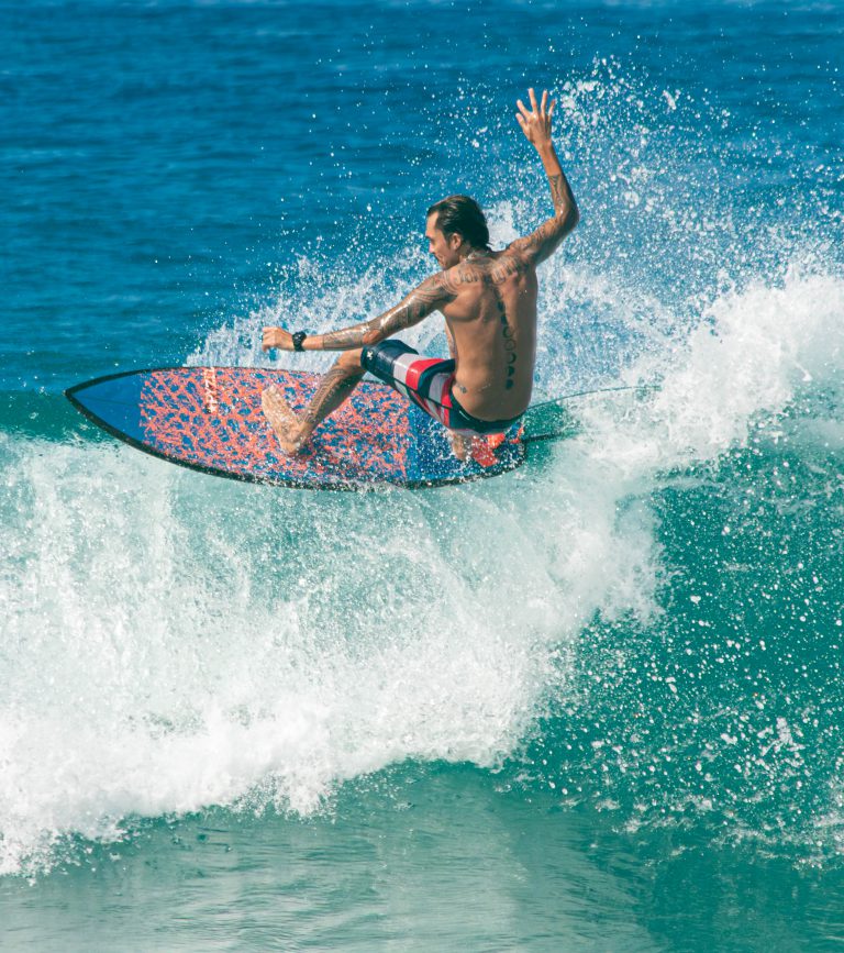 Surfer shredding on a wave