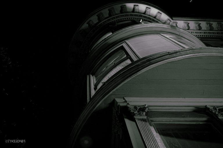 Black and white photo looking up at a bay window in San Francisco