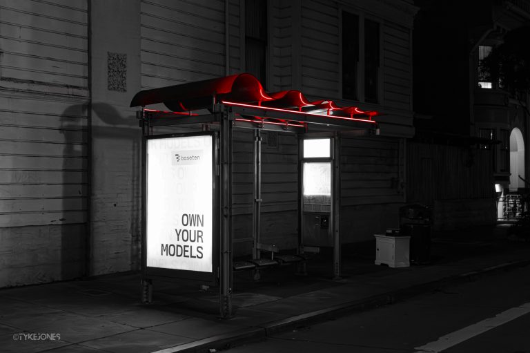 Black and white photo of a bus stop in San Francisco